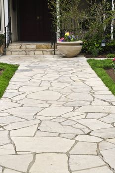 Natural stone path leading to a house, landscaping element