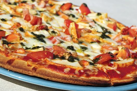 Freshly baked mediterranean pizza served on a plate