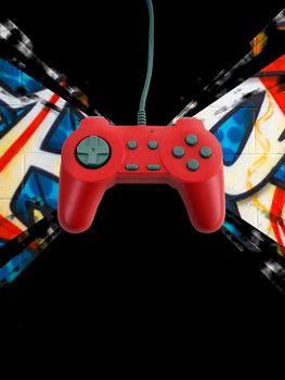 A red game controller over a graffiti background with plenty of copy space.  This file includes the clipping path.  