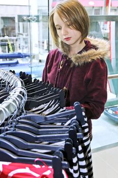 Teenage girl shopping for clothes and accessories