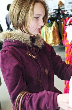 Teenage girl shopping for clothes and accessories