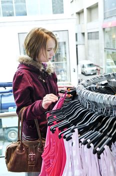 Teenage girl shopping for clothes and accessories