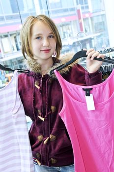 Teenage girl shopping for clothes and accessories