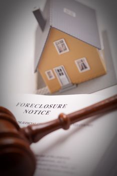 Foreclosure Notice, Gavel and Model Home with Selective Focus.