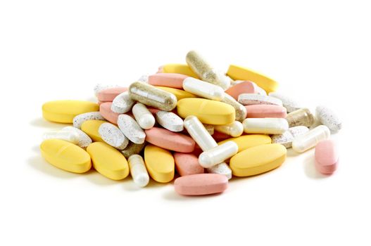 Mix of vitamins and herbal supplements on white background