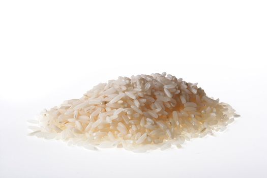Hill of white rice grains on a white background.