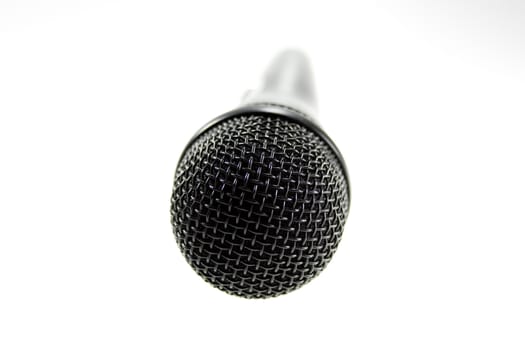 Black microphone on white background