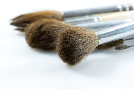 Different thickness proffesional brushes on gray background