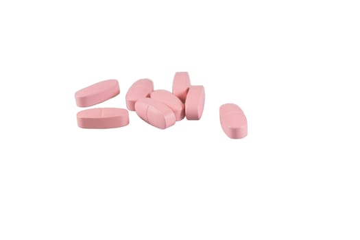 pink pills isolated on white background