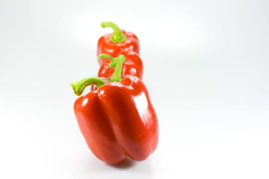 Red peppers on white&gray background