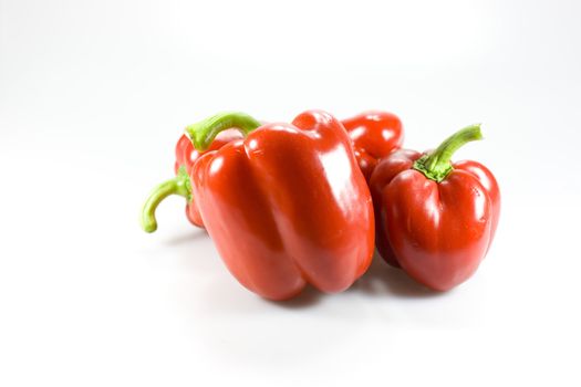 Red peppers on white background