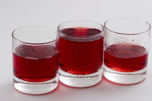 Glass glasses with a red drink