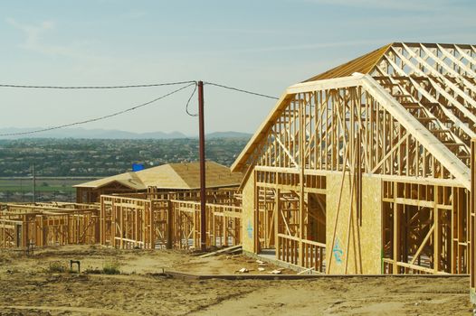 New residential construction home framing site.