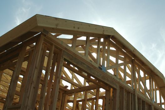 New residential construction home framing site.