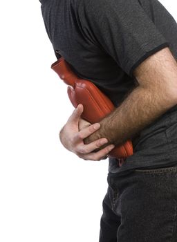 Profile view of a man holding a hot water bottle to soothe his stomach