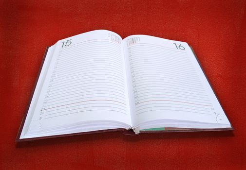 white book. personal diary  on  red background