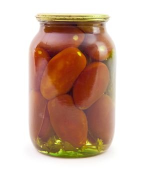 Marinated tomatoes inside a glass jar is isolated on a white background