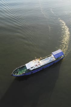 Blue and white boat in sunshine