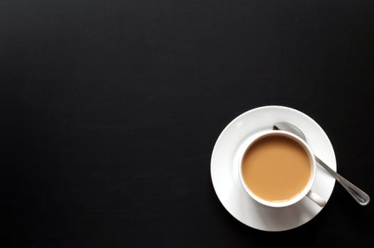cup of coffee and black copyspace for text message