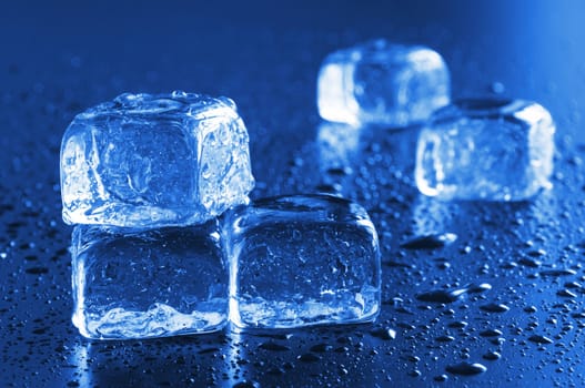ice cube macro in blue with water drops