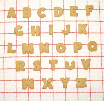 Alphabet written with bisquits