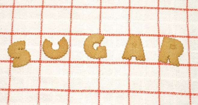 sugar written with bisquits