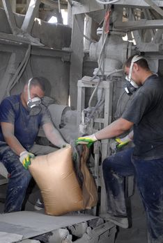 Workers on the cement factory 