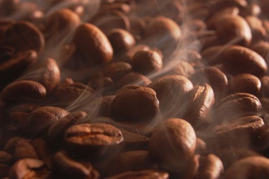 roasting coffee beans with smoke and steam