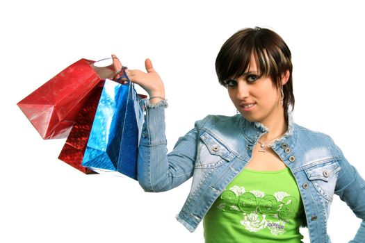 The happy girl with purchases, on a white background 