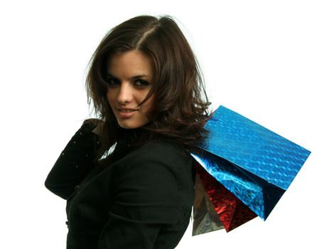 The happy girl with purchases, on a white background 