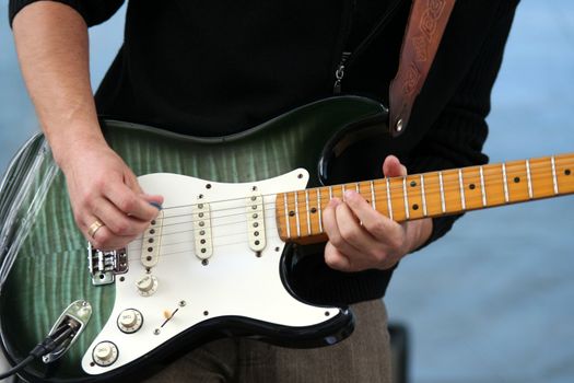 Electrical guitarist playing music
