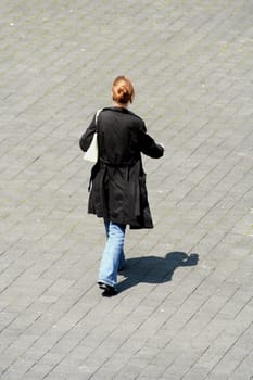 Young woman walking in the street