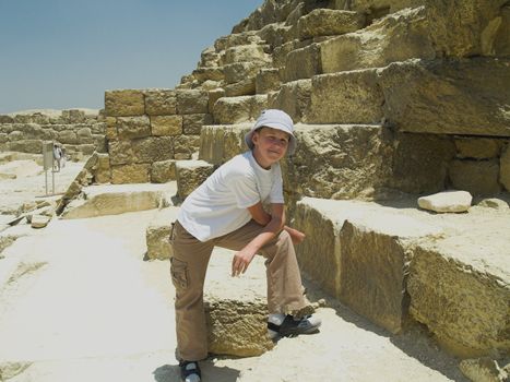 Boy near the Greate Pyramid of Giza. Egypt Cairo