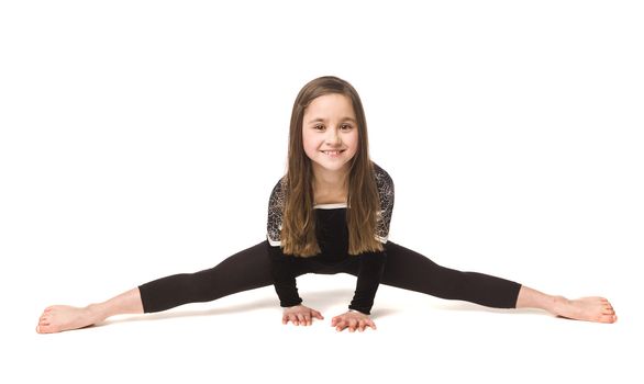 Young girl doing gymnastics isolated on white background