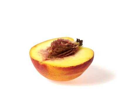 Half of tasty juicy peaches on a white background