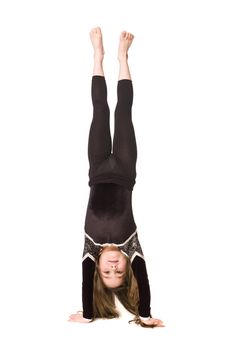 Young girl doing gymnastics isolated on white background