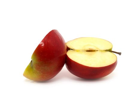 Halves of apple variety called Montuan, isolated on white.