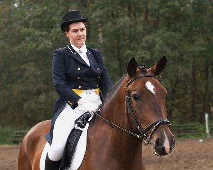 Girl horseback riding English style.