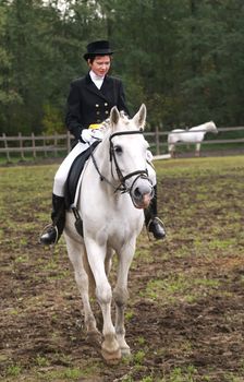Girl horseback riding English style.