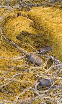 Yellow old tangled fishing nets background image.