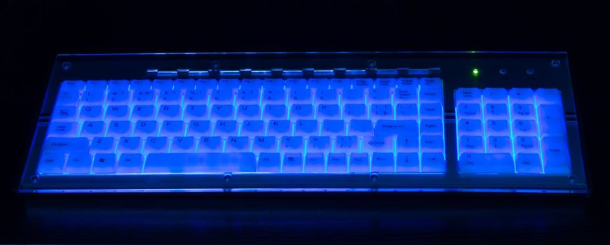 Luminant blue keyboard on black background