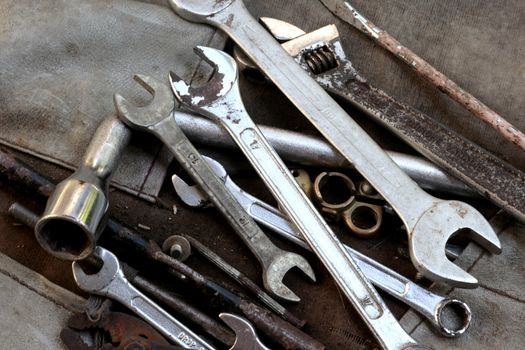 Car Engine Tools in use - wrench, spanners, screw drivers