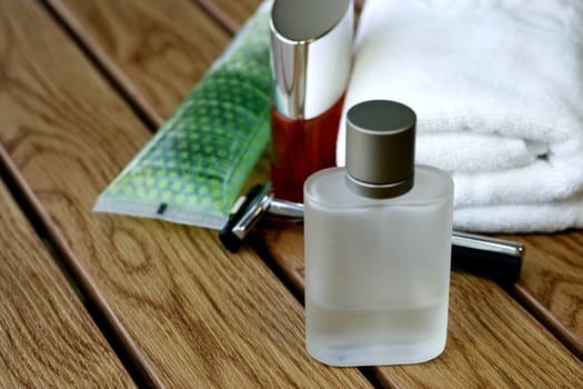 Fragrances bottle and Mens Accessories in wooden tile