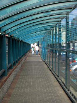 Sheltered walk way with couple walking away