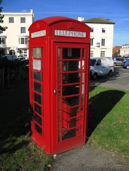 Traditional British telephone box in urban setting