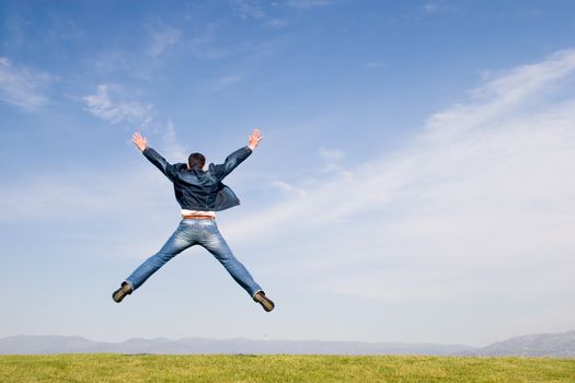 Man jumping on green field