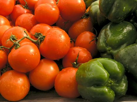 Bunch og tomatos and green peppers