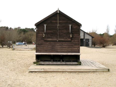 A beach structure stands empty and isolated during the cold winter months