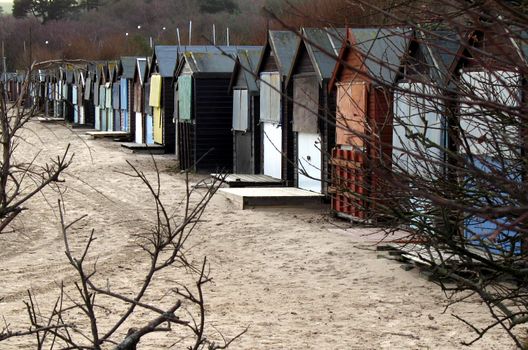 Beach on winter day with row of beach huts