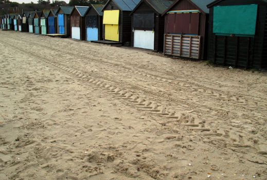 Beach on winter day with row of beach huts